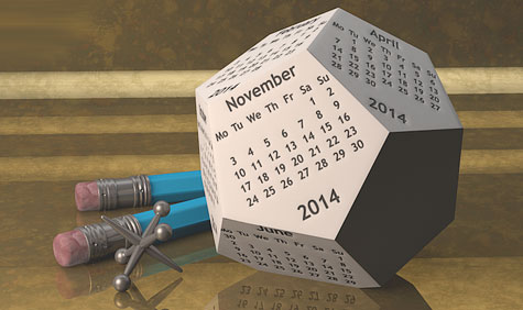 Illustration of a dodecahedron shaped calendar with November 2014 facing and two pencils on a desktop.